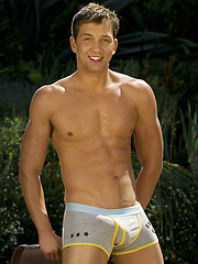 Jonathan Lowe posing naked outdoors