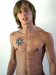 Blonde twink Skyler strips naked and shows off his cock
