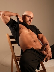 Bald hottie shows his uncut dick