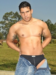 Hot latino stallion Alexander Senna strips & shows his sexy body by the river
